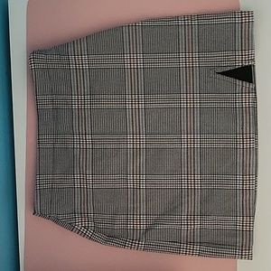 Plaid skirt with small cut out.